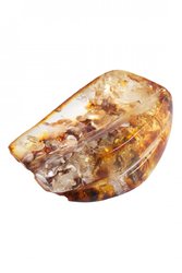 Amber brooch with relief carvings