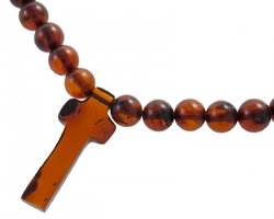 Beads made of amber balls with a cross