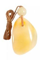 Pendant made of polished amber stone and amber ball