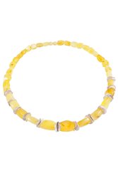 Amber beads with decorative inserts