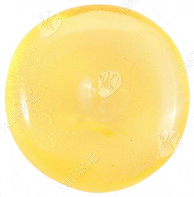 Pendant made of polished translucent amber in the shape of a donut