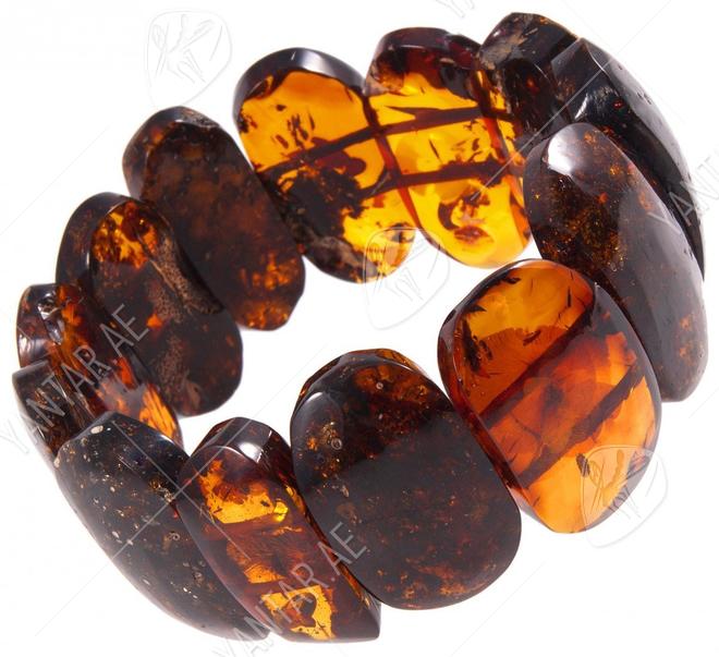 Amber bracelet made of polished oval plates in cognac shade