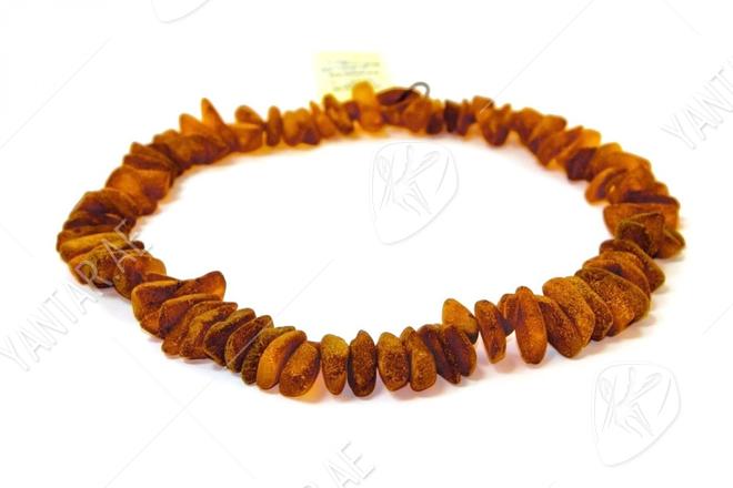 Beads made of honey amber stones Beads made of honey amber stones