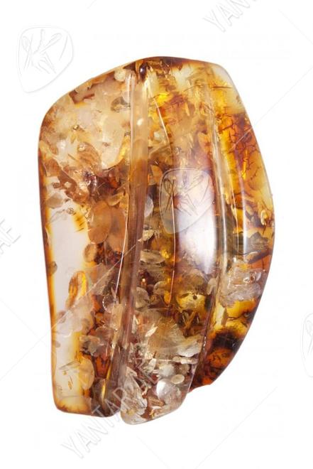 Amber brooch with relief carvings