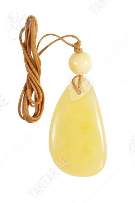 Pendant with polished stone and amber ball