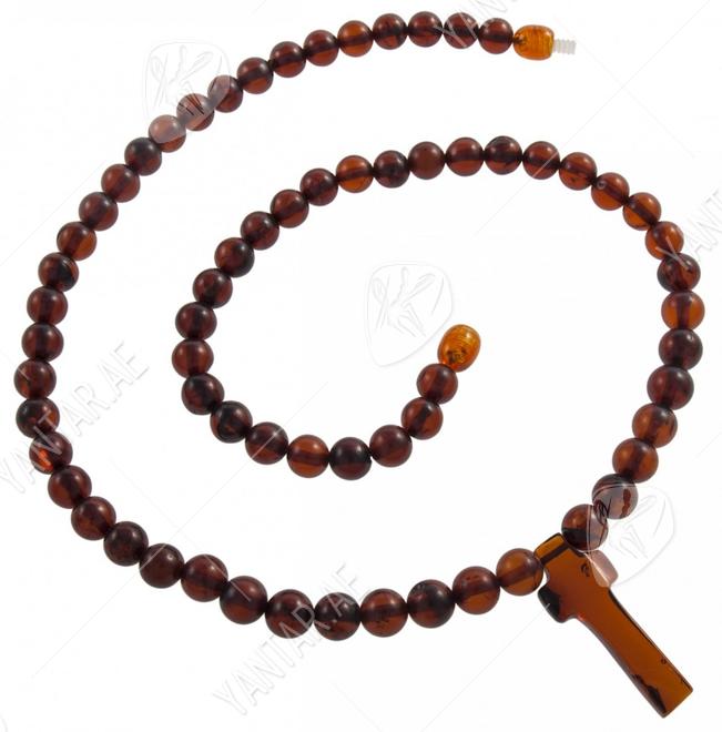 Beads made of amber balls with a cross