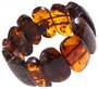 Amber bracelet made of polished oval plates in cognac shade