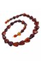Beads made of dark amber stones in the shape of a heart