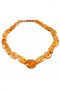 Beads made of figured amber stones