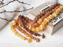 Medicinal beads with polished amber stones